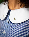 Bee embroidery on white collar, navy piping outer collar, navy gingham shirt.